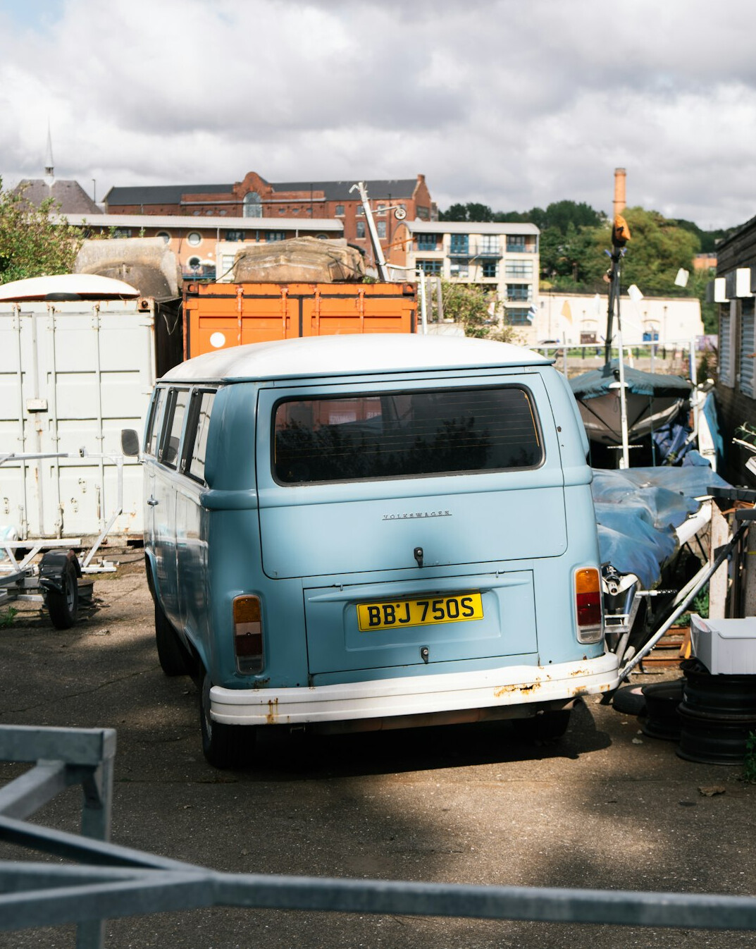 Outside broadcast van parked at a live event with cables and equipment